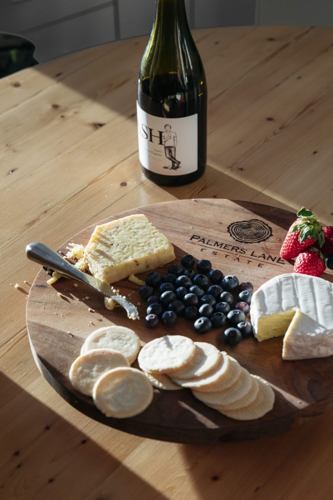 Cheese platter and bottle of wine